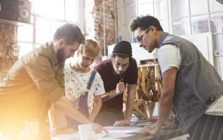 4 teammates discussing brand strategy